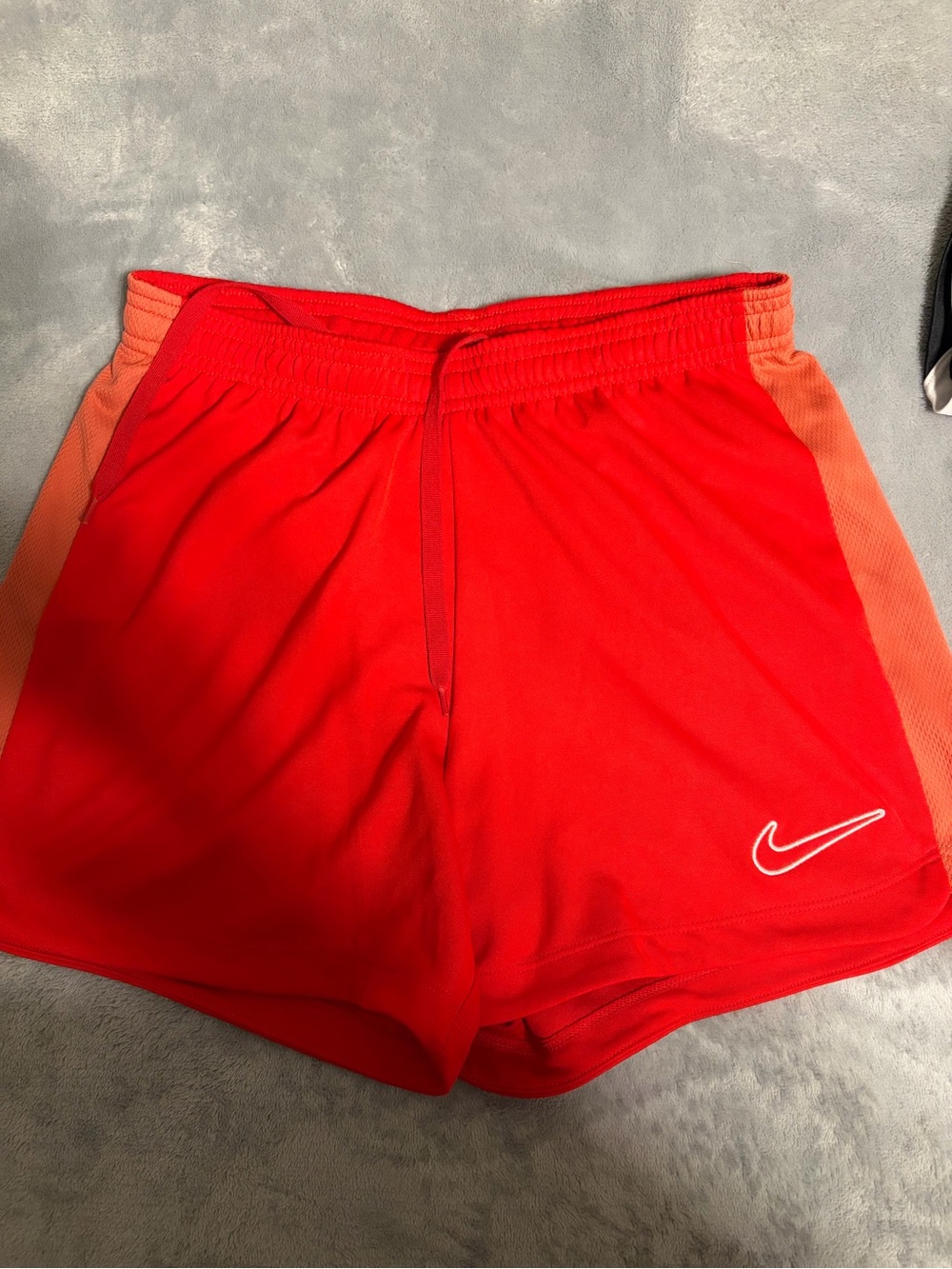 Nike Women’s Red Athletic Shorts with Orange Side Panels